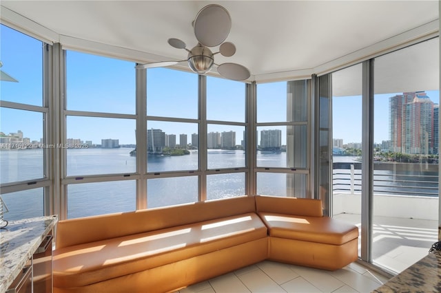 unfurnished sunroom with a water view