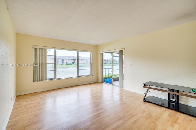 empty room with light hardwood / wood-style floors