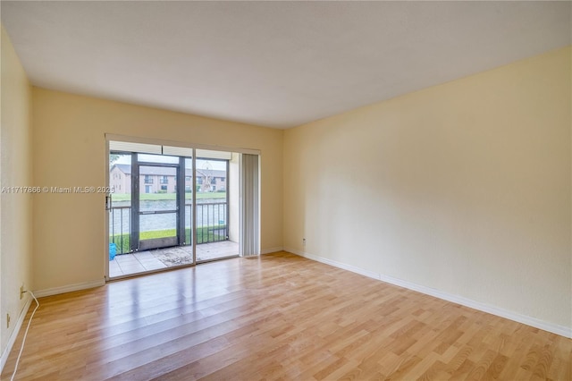 spare room featuring light hardwood / wood-style flooring