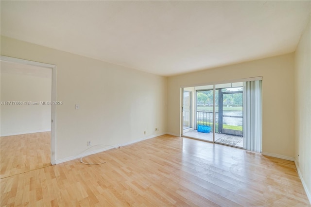 unfurnished room featuring light wood-type flooring