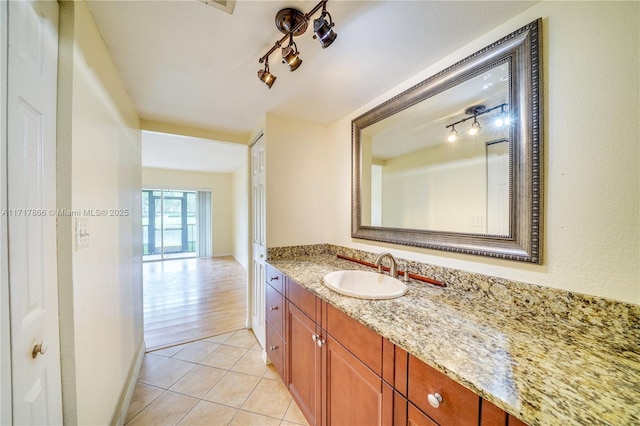 bathroom with tile patterned flooring and vanity