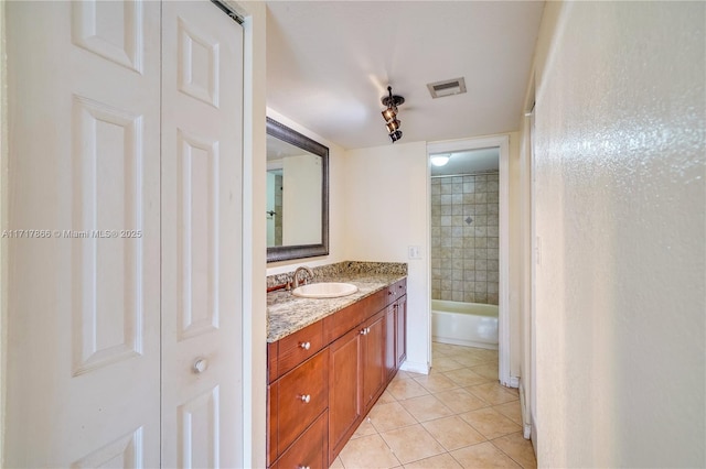 bathroom with vanity and tile patterned floors