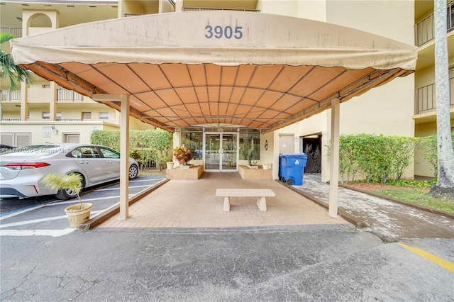 view of vehicle parking with a carport