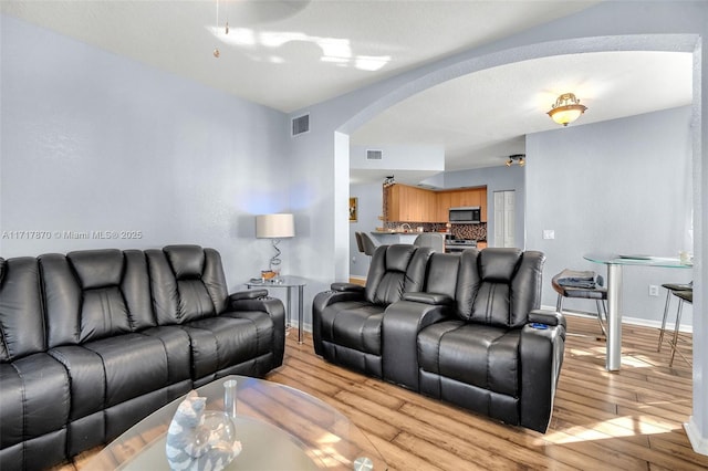 living room with light hardwood / wood-style flooring