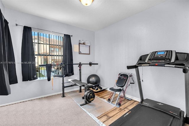 workout area featuring carpet flooring