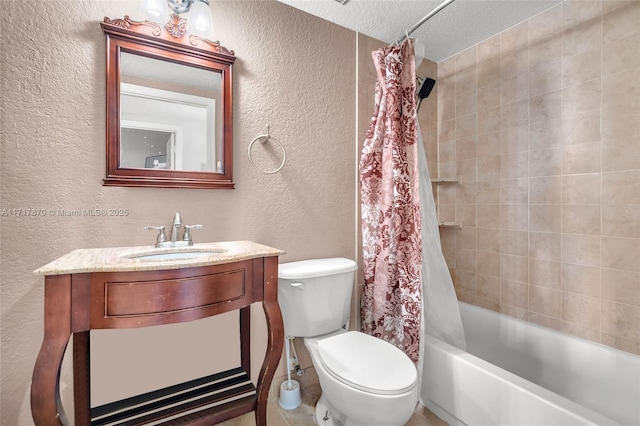 full bathroom with shower / tub combo with curtain, vanity, a textured ceiling, and toilet