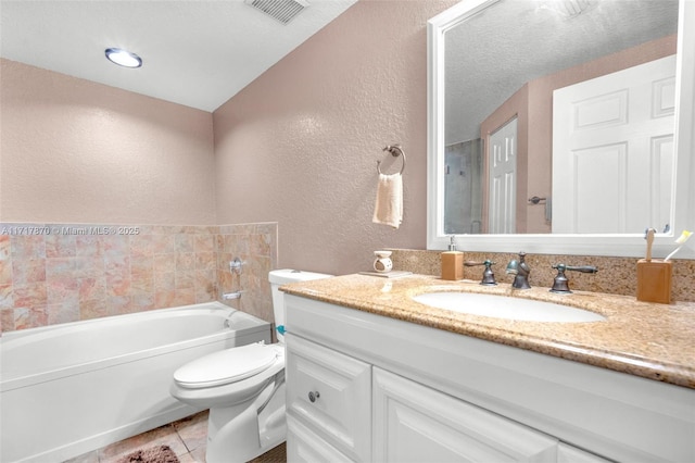 bathroom featuring a bathtub, tile patterned flooring, vanity, and toilet