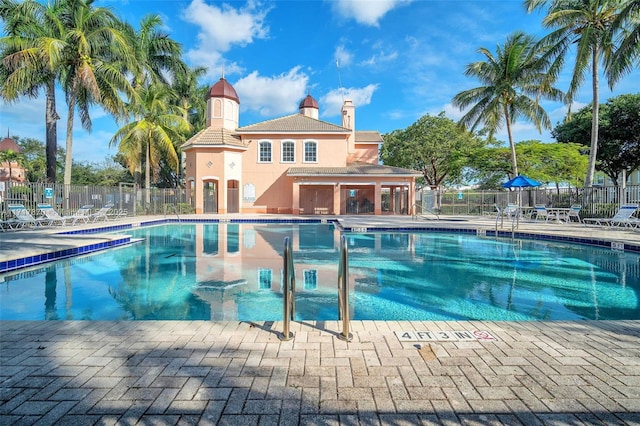 view of swimming pool with a patio area