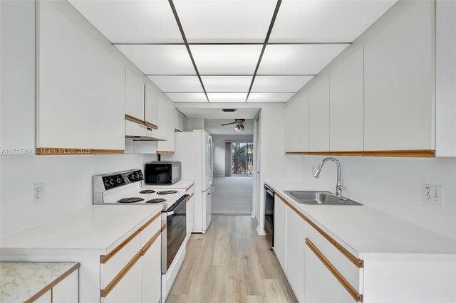 kitchen featuring ceiling fan, sink, white cabinetry, and black appliances