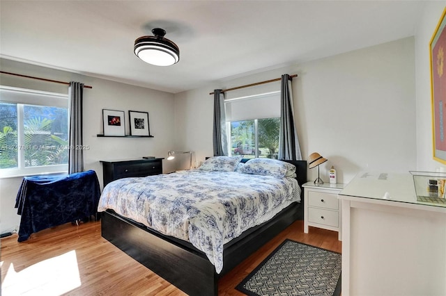 bedroom with wood-type flooring