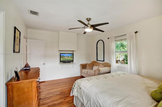 bedroom featuring ceiling fan and light hardwood / wood-style floors