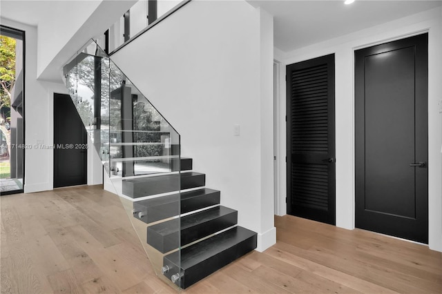 stairway featuring hardwood / wood-style flooring