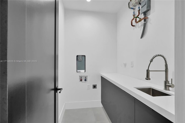 laundry room with electric dryer hookup, sink, and washer hookup