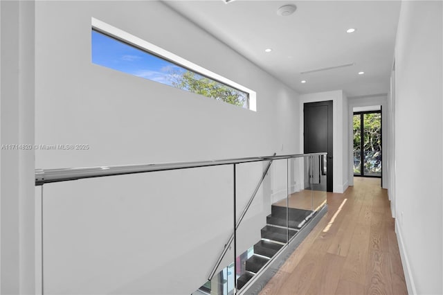 stairs with hardwood / wood-style flooring