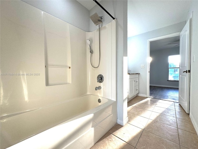 bathroom featuring tile patterned flooring, vanity, and bathtub / shower combination