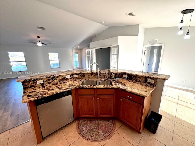 kitchen featuring dishwasher, french doors, sink, ceiling fan, and an island with sink