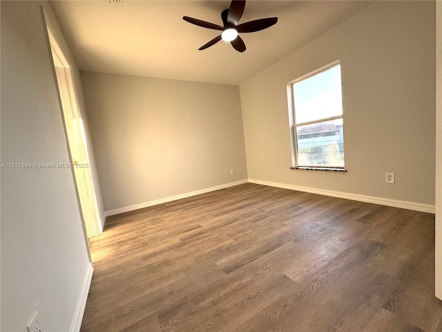 unfurnished room with hardwood / wood-style floors and ceiling fan