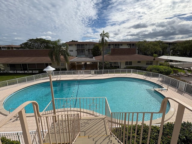 view of pool featuring a patio area