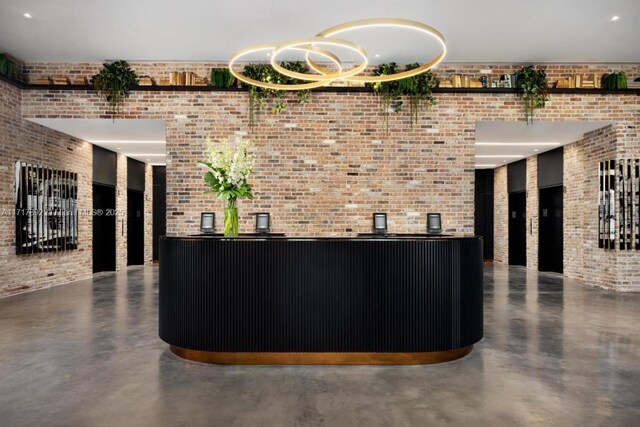 398 NE 5th St Unit 2810, Miami, FL 33132 - reception with brick wall