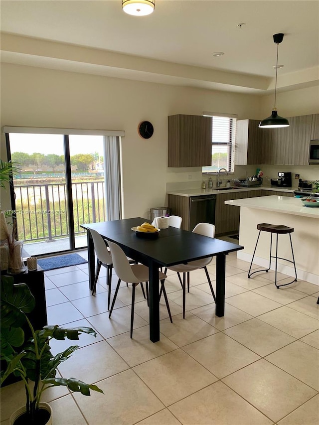 dining space featuring light tile patterned flooring