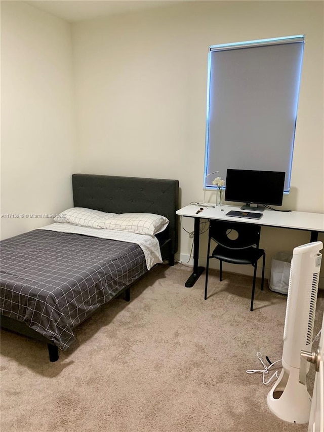 bedroom featuring light colored carpet