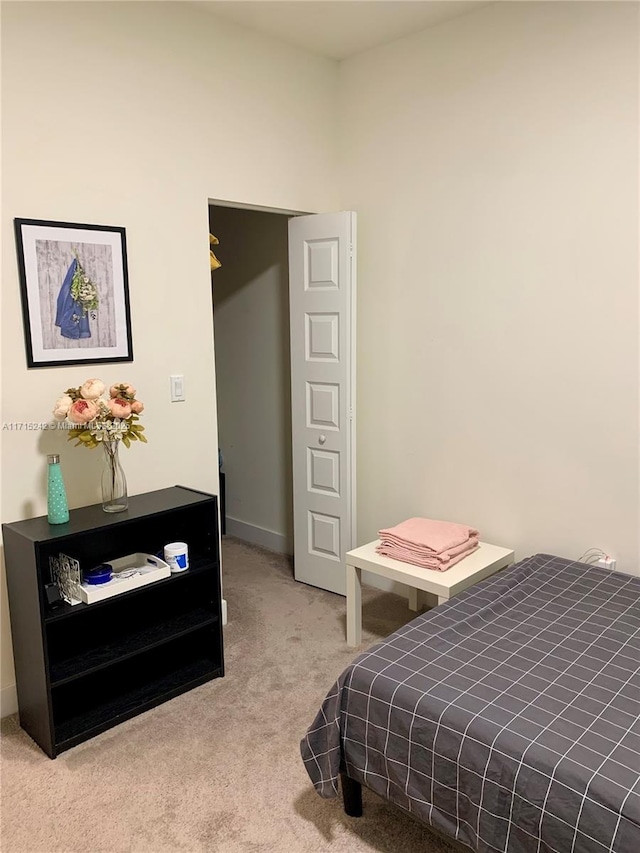 bedroom featuring light colored carpet