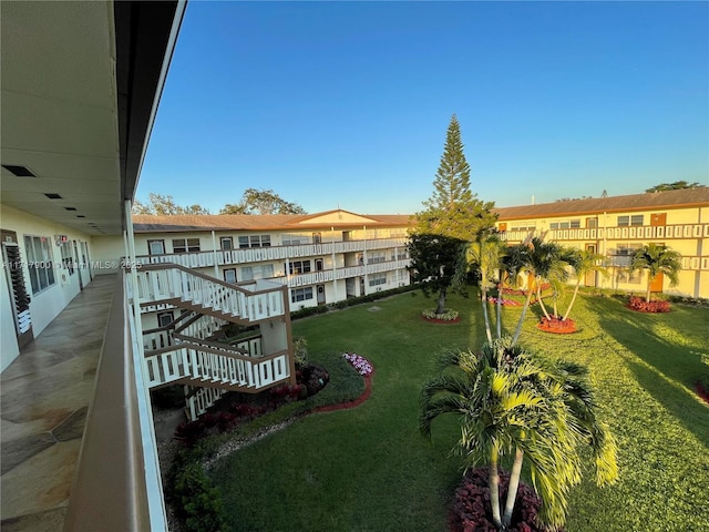 view of property's community featuring a yard