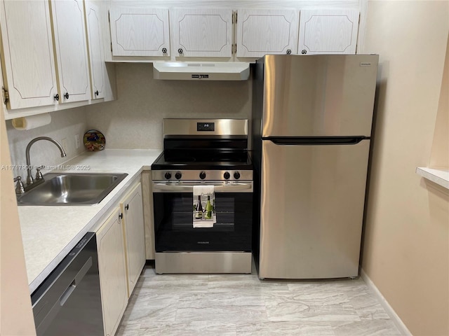 kitchen featuring white cabinetry, sink, and appliances with stainless steel finishes