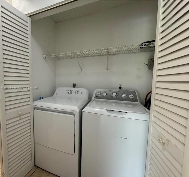 laundry room featuring washing machine and dryer