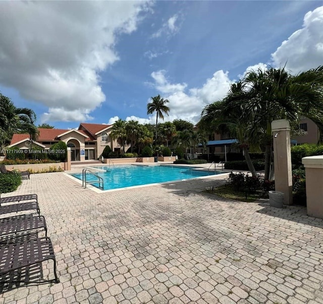 view of swimming pool with a patio