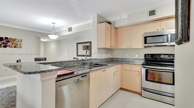 kitchen with kitchen peninsula, appliances with stainless steel finishes, light brown cabinetry, sink, and light tile patterned floors