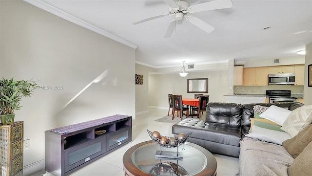 tiled living room featuring ceiling fan, sink, and ornamental molding