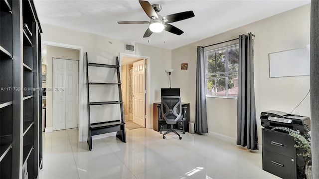 office space with ceiling fan and light tile patterned floors