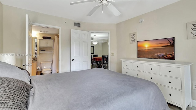 bedroom with ceiling fan and connected bathroom