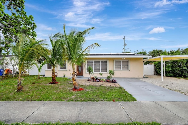 single story home featuring a front yard