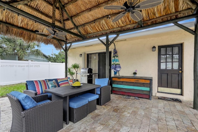 view of patio featuring a grill, ceiling fan, and an outdoor hangout area