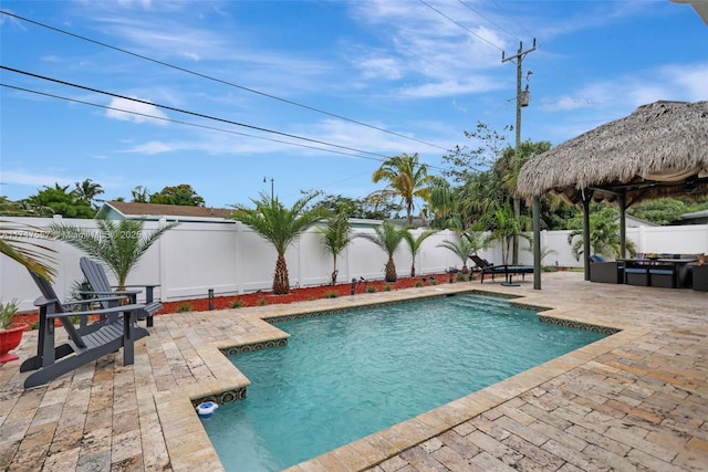 view of swimming pool with a gazebo and a patio area