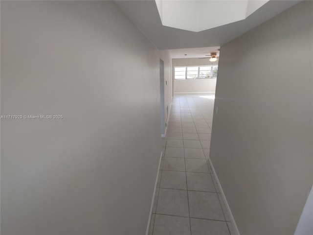 corridor featuring light tile patterned flooring