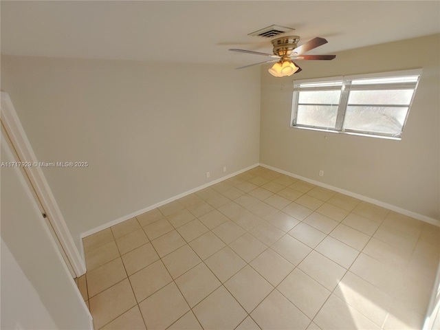 unfurnished room featuring ceiling fan and light tile patterned floors