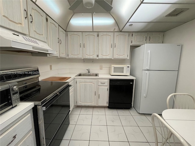 kitchen with black appliances, ceiling fan, and sink