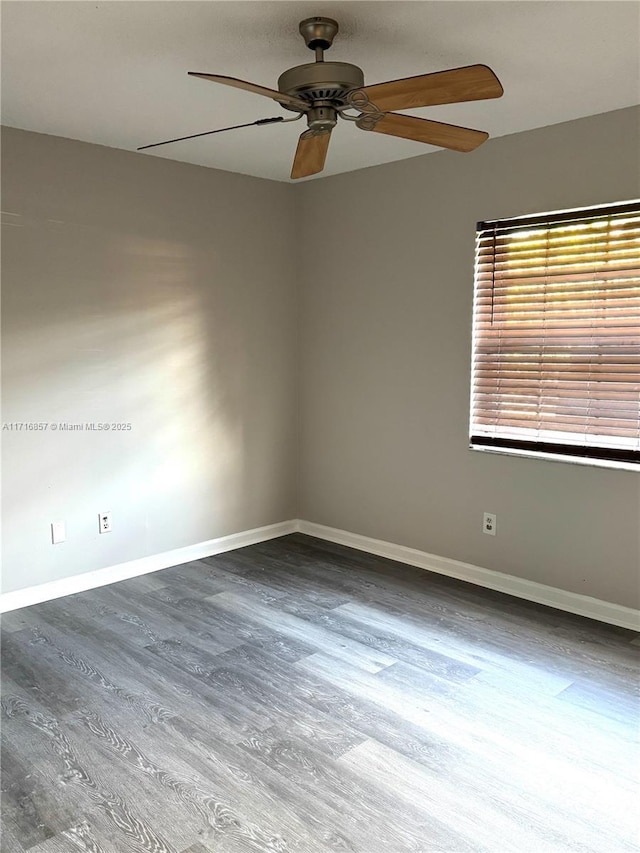 spare room featuring ceiling fan and wood-type flooring