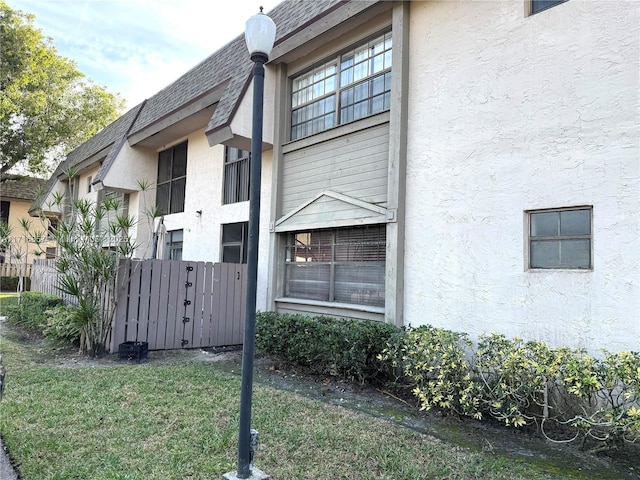 view of home's exterior with a yard