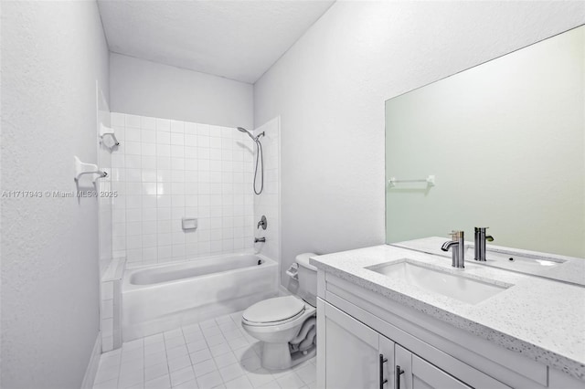 full bathroom featuring tile patterned floors, tiled shower / bath combo, toilet, and vanity