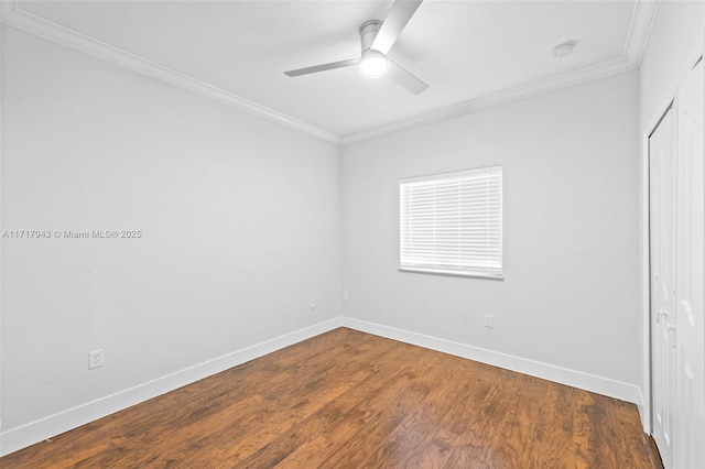 empty room featuring dark hardwood / wood-style floors, ceiling fan, and ornamental molding