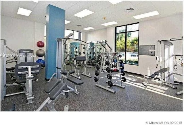 workout area featuring a drop ceiling