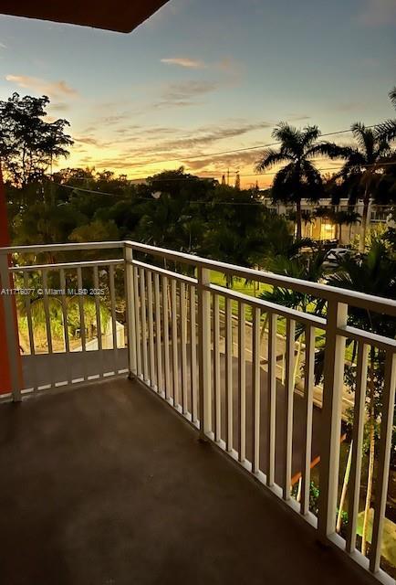 view of balcony at dusk