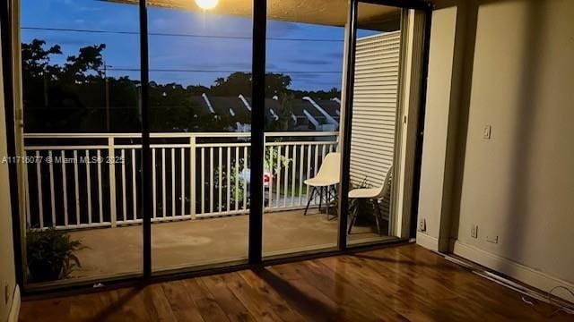 entryway with hardwood / wood-style flooring