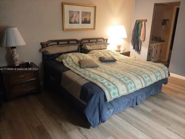 bedroom with wood-type flooring