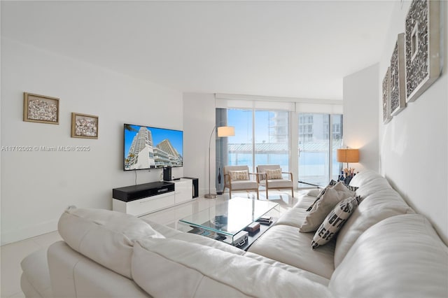 living room featuring floor to ceiling windows