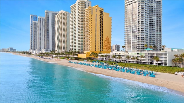 exterior space featuring a water view and a view of the beach